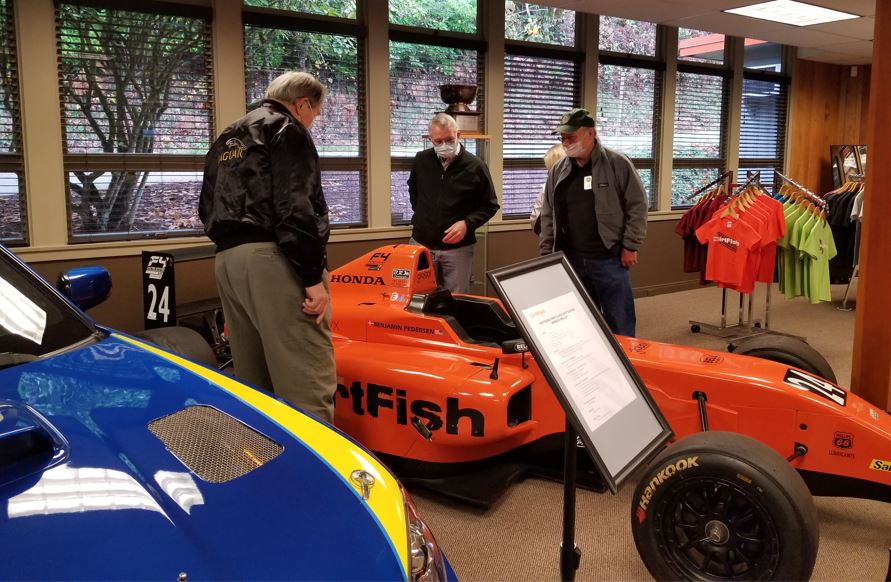 Paul, Brian and Tom looking over a DirtFish sponsored US Formula Four car.