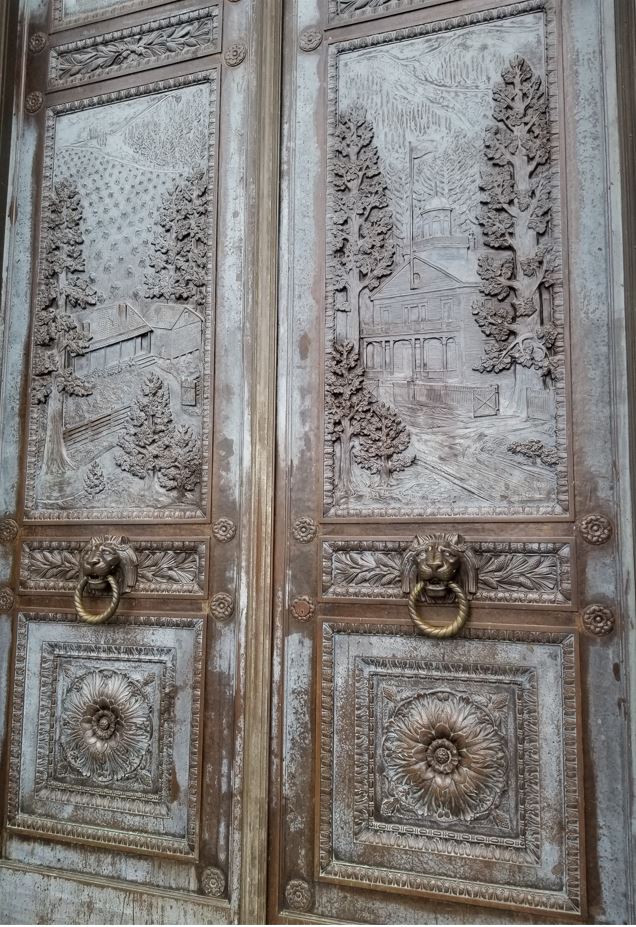 Door panels showed an early capital building.