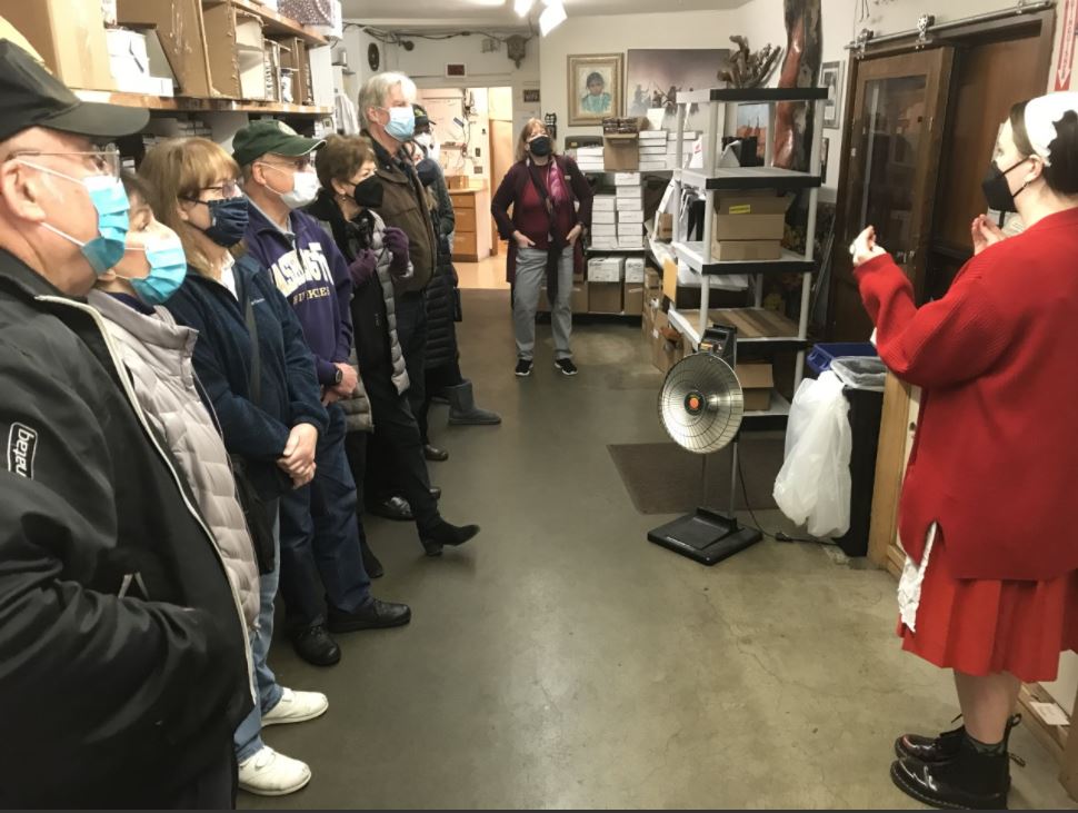A tour guide talking about on how they make their candies.