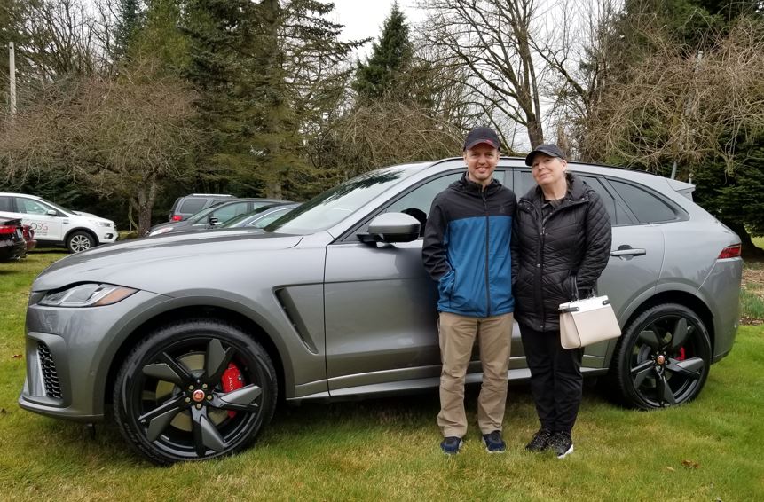 Craig & Wendy Duckering posed for me in their new 2021 F Pace SVR, Eiger Grey color.